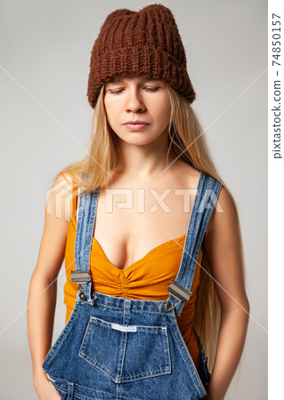 Positive hipster woman in trendy outfit against white background Positive hipster woman in trendy outfit against white background 74850157