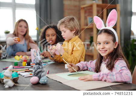Little girl painting at art lesson Little girl painting at art lesson 74851231