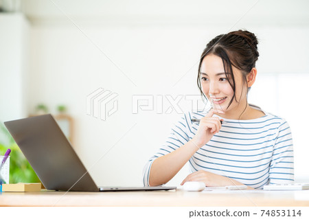 Young woman doing telework in the living room 74853114