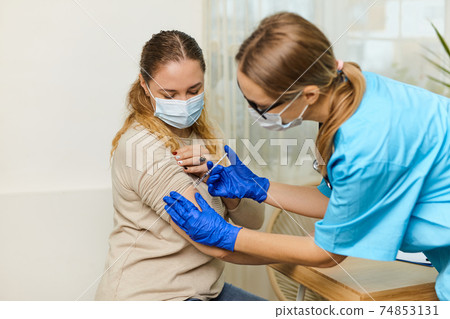 Close up of man vaccinated in a doctor's office 74853131