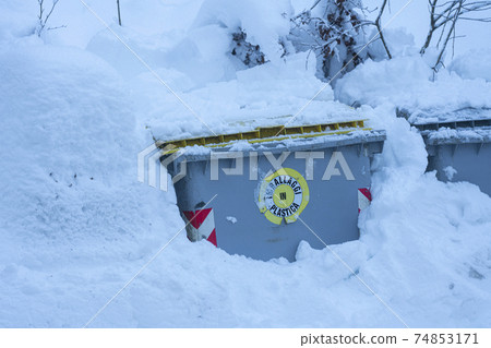 Bins buried by the snow 74853171