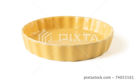 Side view of round yellow ceramic plate with wavy edge isolated on a white background. Side view of round yellow ceramic plate with wavy edge isolated on a white background. 74853181