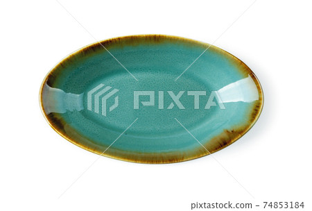 Top view of oblong turquoise ceramic plate isolated on a white background. Top view of oblong turquoise ceramic plate isolated on a white background. 74853184
