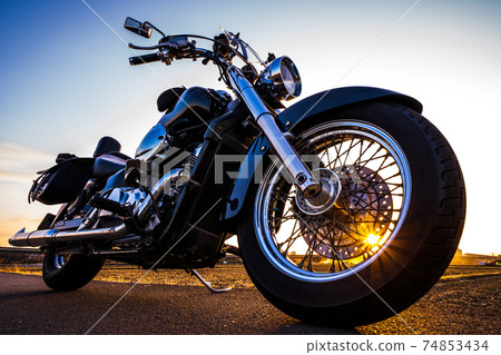 Cool American bike and sunset Cool American bike and sunset 74853434