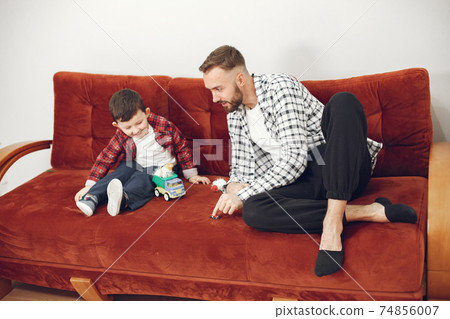 Father and little son have fun at home 74856007