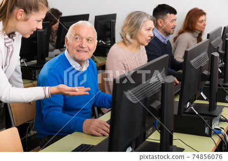 Smiling senior man during computer classes 74856076