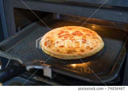 Pizza baked in a gas oven 74856467