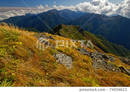 View of autumn leaves of Mt. Shiomi and Mt. Arakawa in the Southern Alps View of autumn leaves of Mt. Shiomi and Mt. Arakawa in the Southern Alps 74856623