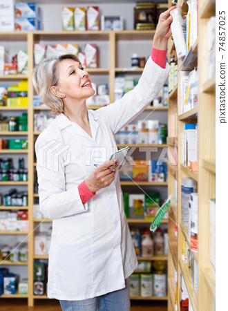 Woman seller checking assortment of care product 74857025