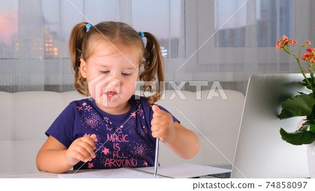 Online lessons for children. Homeschooling and distance education for kids. Girl student study Online lessons for children. Homeschooling and distance education for kids. Girl student study 74858097