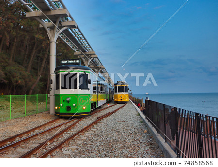 Haeundae Beach Train Running on Railway, Busan, South Korea Asia. 74858568