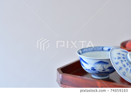 Tea bowl with lid. Decorate on a high-footed set. Antique Imari ware ceramics. Tea bowl with lid. Decorate on a high-footed set. Antique Imari ware ceramics. 74859183