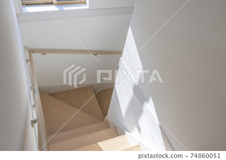 The stairs of a wooden house with sunlight The stairs of a wooden house with sunlight 74860051