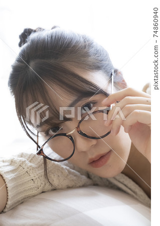 Portrait of a woman with glasses 74860940