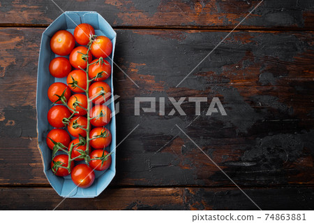 Fresh red organic cherry tomatoe, on dark wooden background with copy space for text 74863881