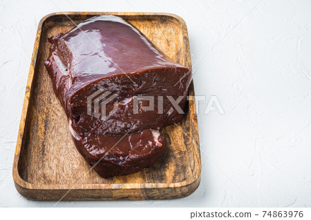 Beef liver on white background with copy space 74863976