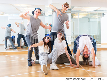 Teens hip hop dancers posing in studio 74864932