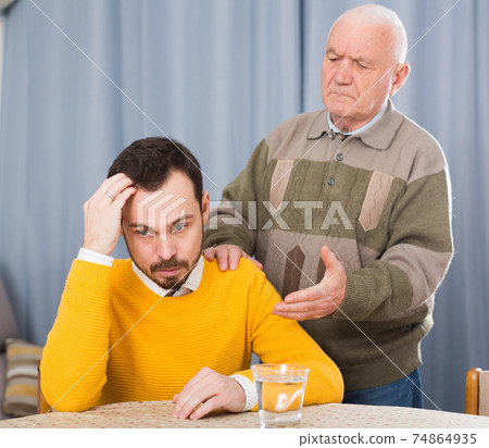 Old father and son serious talk Old father and son serious talk 74864935