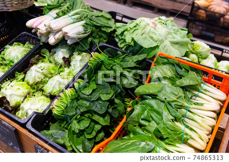 Counter of greengrocery with fresh greens Counter of greengrocery with fresh greens 74865313