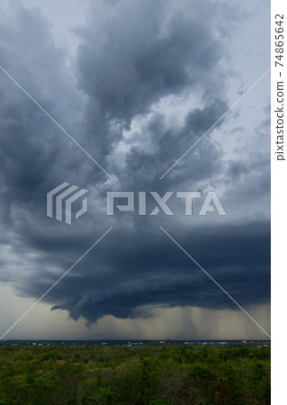 .Storm clouds with the rain. Nature Environment Dark huge cloud sky black stormy cloud .Storm clouds with the rain. Nature Environment Dark huge cloud sky black stormy cloud 74865642