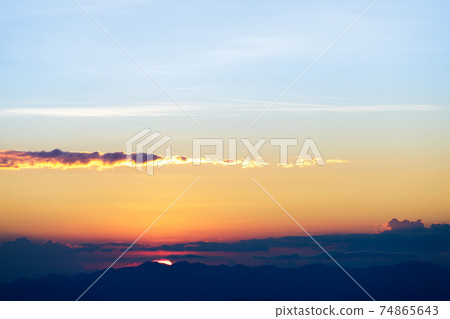 Natural Sunset Sunrise. Bright Dramatic Sky And Dark Ground. Countryside Landscape Under Scenic Colorful Sky Natural Sunset Sunrise. Bright Dramatic Sky And Dark Ground. Countryside Landscape Under Scenic Colorful Sky 74865643