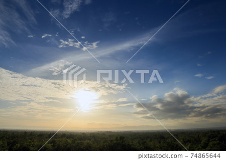 Natural Sunset Sunrise. Bright Dramatic Sky And Dark Ground. Countryside Landscape Under Scenic Colorful Sky. Natural Sunset Sunrise. Bright Dramatic Sky And Dark Ground. Countryside Landscape Under Scenic Colorful Sky. 74865644