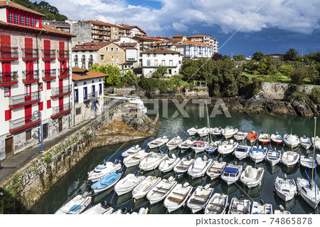 View of the Port of Mundaka in the Basque country, Spain. Mundaka is famous for its surfing. View of the Port of Mundaka in the Basque country, Spain. Mundaka is famous for its surfing. 74865878