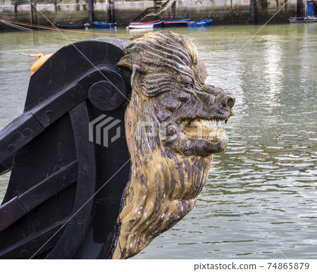 Decorative figure of a lion on the prow of an ancient sailboat at Bermeo in the Basque Country, Spain Decorative figure of a lion on the prow of an ancient sailboat at Bermeo in the Basque Country, Spain 74865879