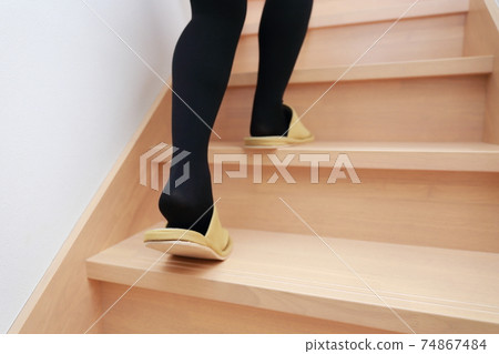 Women's legs climbing stairs Women's legs climbing stairs 74867484