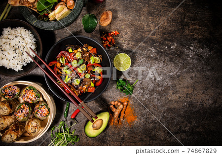 Various of asian meals on rustic background , top view Various of asian meals on rustic background , top view 74867829