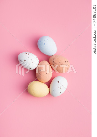Colorful chocolate easter eggs. Sweet candy eggs on pink background. 74868103