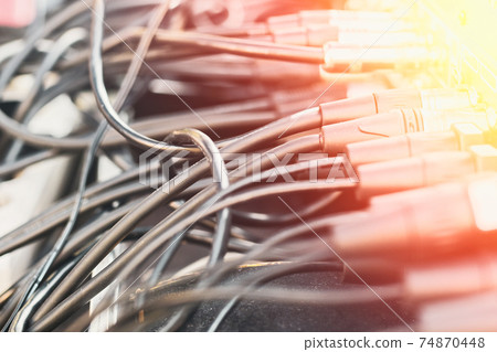 Close up audio jacks cable plugged into mixer console. XLR audio cable Close up audio jacks cable plugged into mixer console. XLR audio cable 74870448