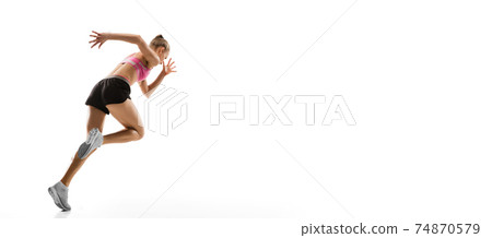 Caucasian professional female runner, athlete training isolated on white studio background. Copyspace for ad. 74870579