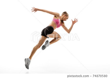 Caucasian professional female runner, athlete training isolated on white studio background. Copyspace for ad. 74870580