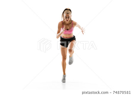 Caucasian professional female runner, athlete training isolated on white studio background. Copyspace for ad. 74870581