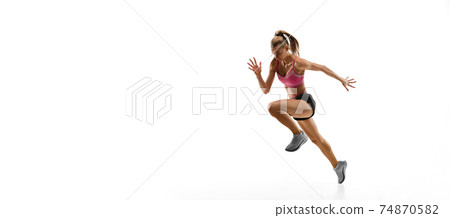 Caucasian professional female runner, athlete training isolated on white studio background. Copyspace for ad. 74870582