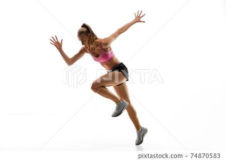 Caucasian professional female runner, athlete training isolated on white studio background. Copyspace for ad. 74870583