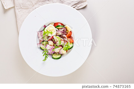 Food banner. Delicious homemade vegetable salad with egg, mozzarella and olive oil. Healthy food. Organic vegetables: Peking cabbage, cucumber, red onions, tomatoes, and arugula. Mediterranean diet. Food banner. Delicious homemade vegetable salad with egg, mozzarella and olive oil. Healthy food. Organic vegetables: Peking cabbage, cucumber, red onions, tomatoes, and arugula. Mediterranean diet. 74873165