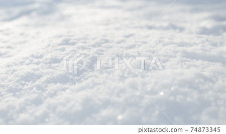 Snow texture. Top view of the white snow. Background with copy space. Winter time Snow texture. Top view of the white snow. Background with copy space. Winter time 74873345