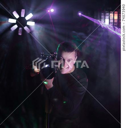man photographer at the evening show. photo with copy space 74873940