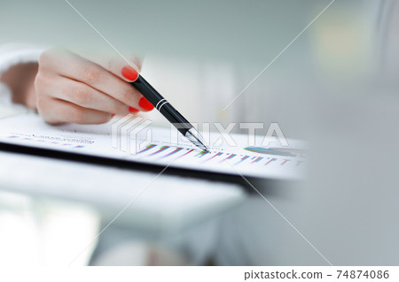closeup.businessman working with a financial schedule. business concept closeup.businessman working with a financial schedule. business concept 74874086
