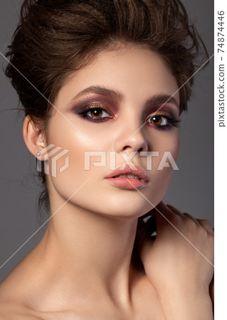 Portrait of beautiful woman with evening makeup Portrait of beautiful woman with evening makeup 74874446