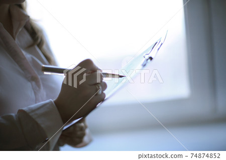 close up. business woman checking financial schedule 74874852