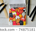 Sketch of cat pattern on wooden background with markers 74875181