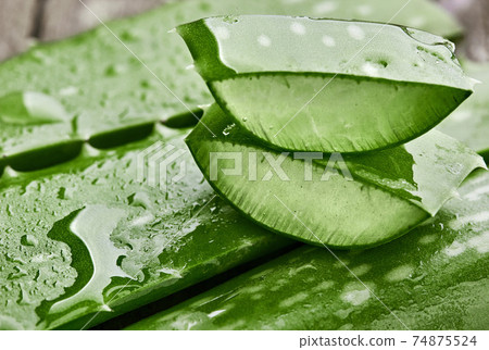 Aloe vera.Pieces of aloe cutting. On wooden table 74875524