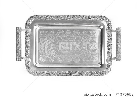 Antique silver tray with handles. Old luxury tray isolated on white background with clipping path. Closeup, top view. Antique silver tray with handles. Old luxury tray isolated on white background with clipping path. Closeup, top view. 74876692