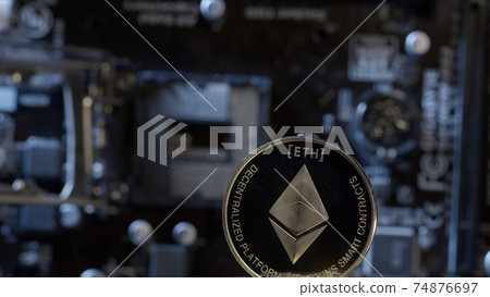 Ethereum coin on computer motherboard background, cryptocurrency mining, virtual money 74876697