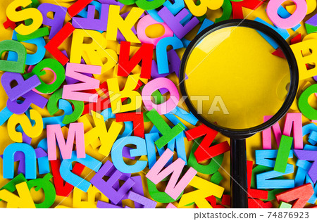 Magnifying glass with colorful alphabet on yellow background, Copy space.Education concept. Magnifying glass with colorful alphabet on yellow background, Copy space.Education concept. 74876923