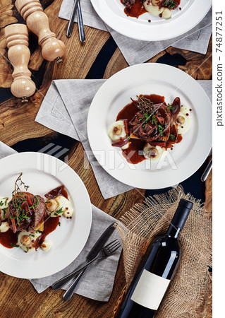 Gourmet appetizer: Beautifully decorated catering banquet foie gras with berries 74877251