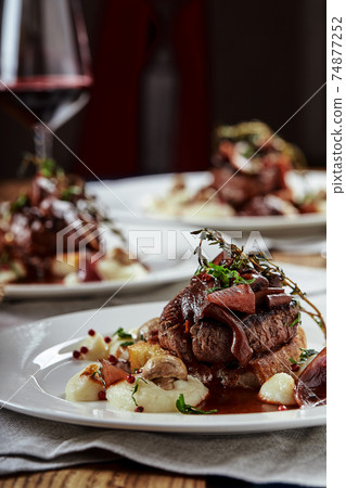 Gourmet appetizer: Beautifully decorated catering banquet foie gras with berries 74877252